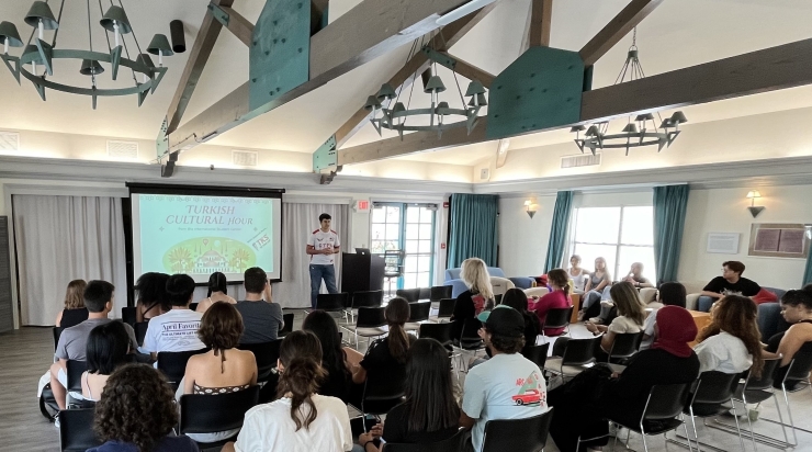 Azerbaijani student Vagif Qiyasli speaks at the Turkish Cultural Hour at San Diego State University. Turkey and Azerbaijan have close cultural ties.