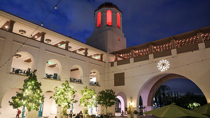 The SDSU campus lit in a red light wash at night.